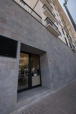 a building with a glass door on the side of it at Beautiful cozy apartment in Cusco