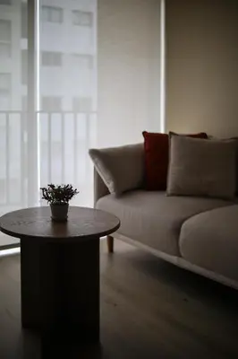 a living room with a couch and a coffee table at Lovely apartment in Lima