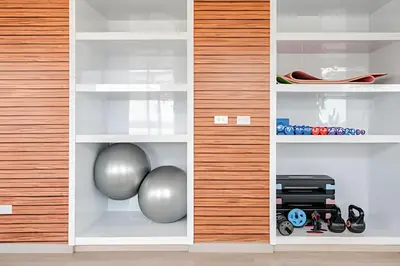 a room with white shelves with balls and other items at Edificio Olavegoya in Lima