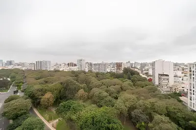 an aerial view of a city with trees and buildings at Edificio Parque Castilla in Lima