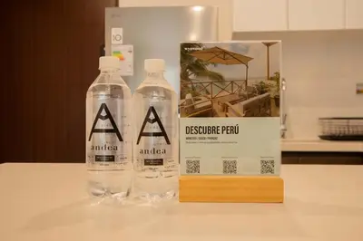 two bottles of water on a table next to a sign at Sight Oceanview in Barranco Malecon by Wynwood House in Lima