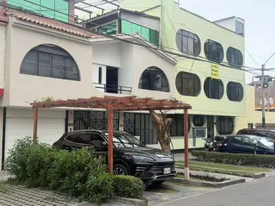 a black car parked in front of a building at Casa de Stephano in Lima