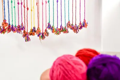 a bunch of yarn hanging from a wall at Apart Hotel El Puma in Cusco