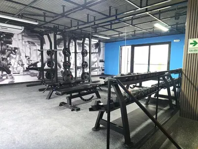 a gym with a row of tread machines in a room at New 1st Fl Executive Patio Pad in Lima
