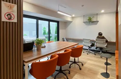 an office with a conference room with a table and chairs at New 1st Fl Executive Patio Pad in Lima
