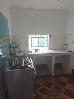 a kitchen with a stove and a counter top at Casa Jardin in Ayacucho