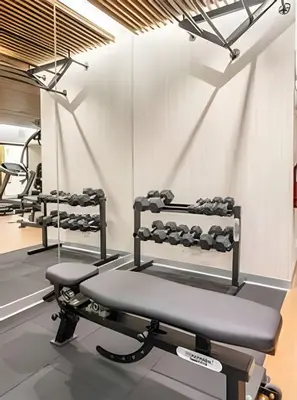 a row of treadmills in a gym at Edificio Plaza 27 in Lima