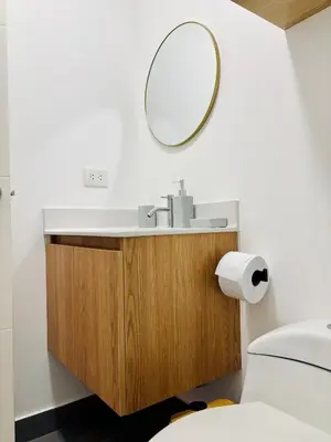 a bathroom with a sink and a mirror on the wall at Modern and centrally located with a rooftop in Lima