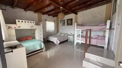 a bedroom with two bunk beds in it at Casa campo vista linda in Mala
