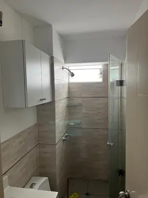 a bathroom with a shower and a toilet at Emilia House in Lima