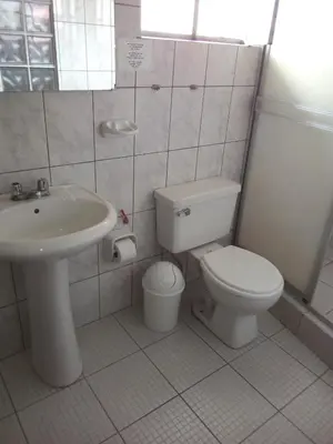 a bathroom with a toilet and a sink at Hostal Cusco Inn in Cusco
