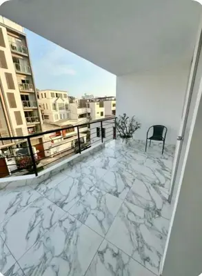 a balcony with a view of a building at alojamiento independiente baño privado in Lima