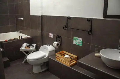 a bathroom with a toilet and a sink at Andean Wings Valley in Urubamba