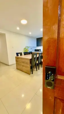 a dining room with a table and chairs in a room at Departamento completo en el primer piso in Ayacucho