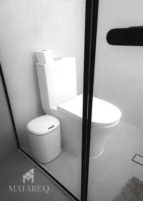 a bathroom with a toilet and a sink at Luxury apartment steps from Plaza de Armas in Cusco