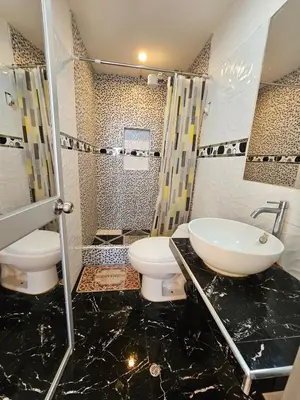 a bathroom with a toilet and a sink at Familiar 1er piso in La Merced
