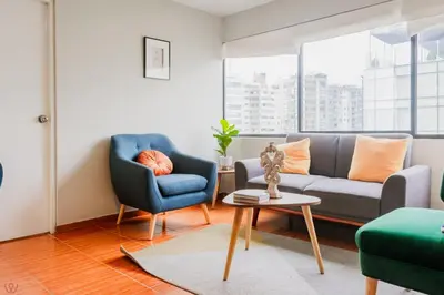 a living room with a couch and two chairs and a table at Appealing 1BR Beautiful View in Miraflores in Lima