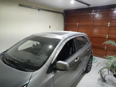 a small silver car parked in a garage at Casa Oasis Meneses in Ica