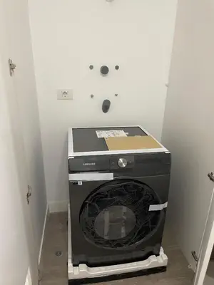 a washer and dryer sitting in the corner of a room at Moderno y Exclusivo Apartamento situado en Barranco in Lima