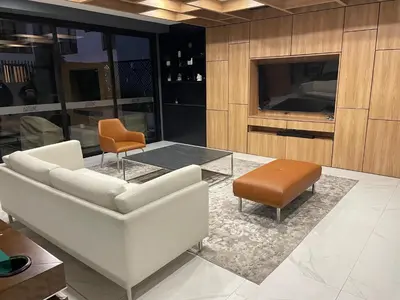 a living room with a couch and a table and a tv at Moderno y Exclusivo Apartamento situado en Barranco in Lima