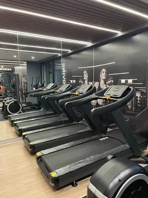 a row of treadles in a gym with mirrors at Moderno y Exclusivo Apartamento situado en Barranco in Lima