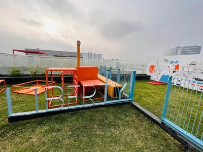 a playground with a play set on the grass at Monterrico Polo Aparts 19 - Dpto de Estreno con Balcon frente Embajada USA in Lima