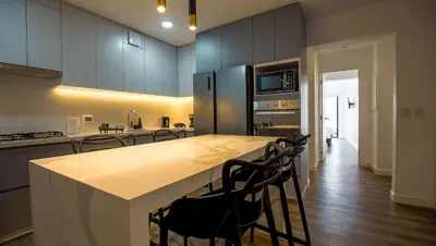 a kitchen with a large island in the middle at e-t*| Apartamento vista espectacular in Lima