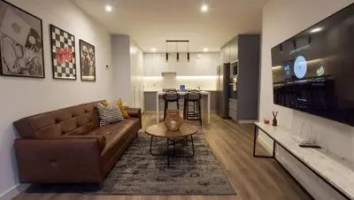 a living room with a couch and a table at e-t*| Apartamento vista espectacular in Lima
