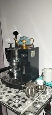 a coffee maker sitting on top of a table at El Rosedal in Lima