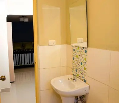 a bathroom with a sink and a mirror at Historical Center Apartments in Cusco