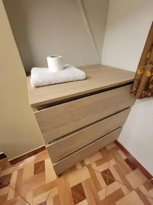 a shelf in a room with a toilet paper on it at LUJO HOGAR - Cerca a Plaza Norte - UNI - Aeropuerto in Lima