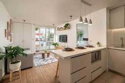 a kitchen with a large island in a room at Departamento en Barranco in Lima
