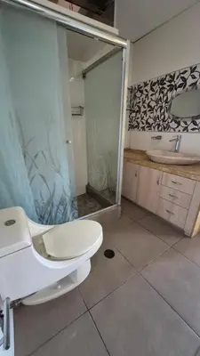 a bathroom with a toilet and a shower and a sink at Dormitorio con baño privado a 25 minutos del Apto in Lima