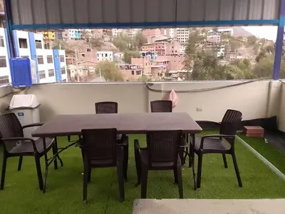 a table and chairs on a balcony with a view at Hospedaje TUTUMEME in Churín