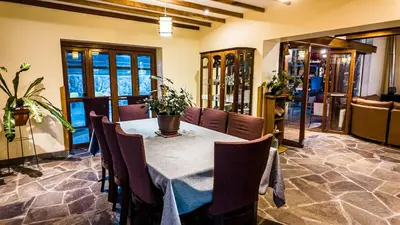 a dining room with a table and chairs at Casa en Calca in Calca