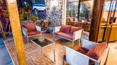 a group of chairs and a table in a room at Casa en Calca in Calca