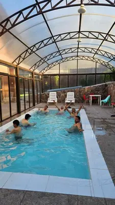 a group of people in a swimming pool at Casa en Calca in Calca