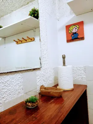 a wooden table with a roll of toilet paper on it at Entire Apartment in Miraflores in Lima