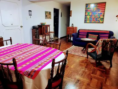 a living room with a bed and a couch at Entire Apartment in Miraflores in Lima