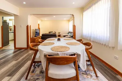 a dining room with a table and chairs at Intiflatscusco Comfortable Stay in the Heart of the City in Cusco