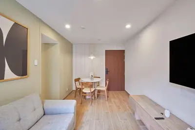 a living room with a couch and a table at Ejército City Lofts & Apartments in Lima