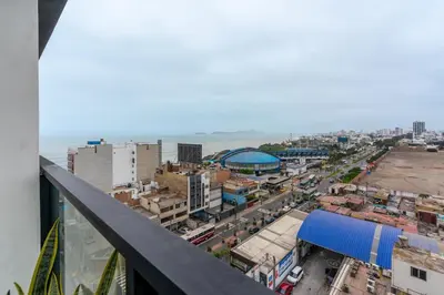 a view of a city from the balcony of a building at Ejército City Lofts & Apartments in Lima
