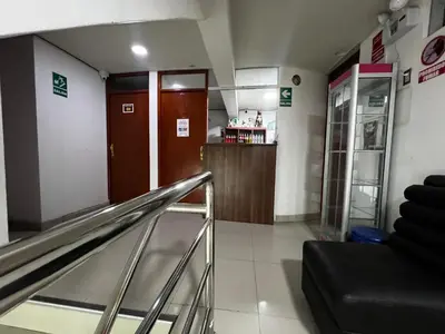an empty lobby with an escalator in a building at Huamanga plaza in Ayacucho