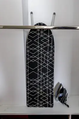 a black and white surfboard on a shelf at BSR Oceanview Family Flat w/ Parking in Lima