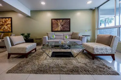a living room with two couches and a coffee table at BSR Oceanview Family Flat w/ Parking in Lima