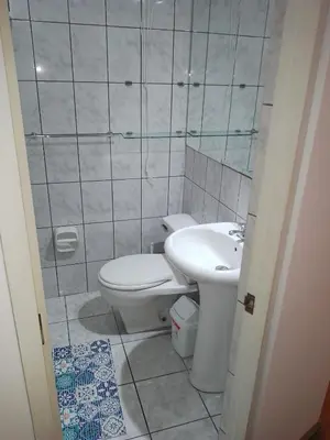 a bathroom with a toilet and a sink at Miraflores, Lima, apartamento 2 dormitorios in Lima