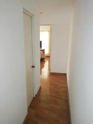 an empty room with a door and a wooden floor at Miraflores, Lima, apartamento 2 dormitorios in Lima