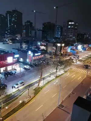 a city at night with cars parked on a street at Miraflores, Lima, mini apartamento 2 ambientes in Lima