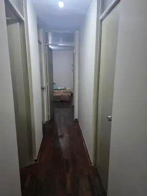 an empty hallway with a room with a bed in it at RODRICH apartment 2 in Lima