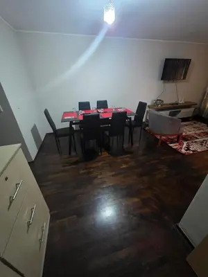 a dining room with a red table and chairs at RODRICH apartment 2 in Lima